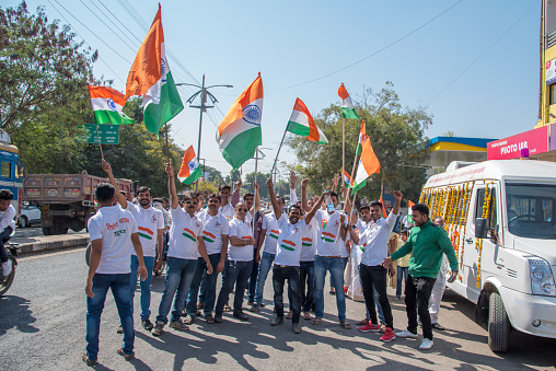 AMRAVATI, MAHARASHTRA, INDIA, JANUARY - 26, 2018: Unidentified people and student celebrating the Indian Republic Day by dancing with flags, drums.