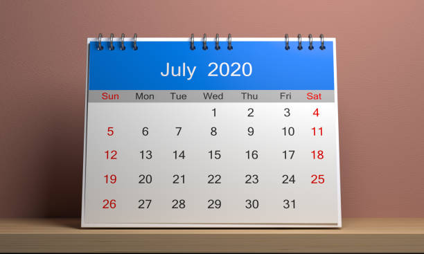 istock 2020 calendar with blue cap standing on wooden shelf 1188628994