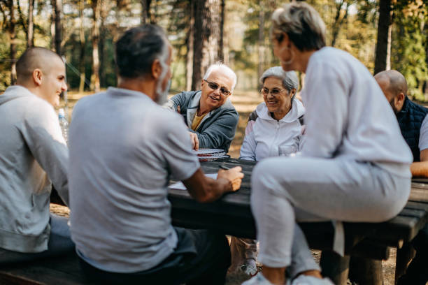 istock Multigenerational group of people plays volleyball 1188630551