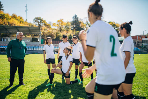 istock Women soccer team with coach on training 1188630612
