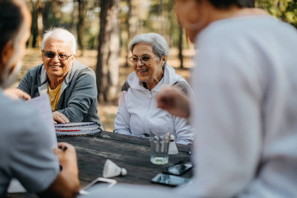istock Multigenerational group of people plays volleyball 1188630631