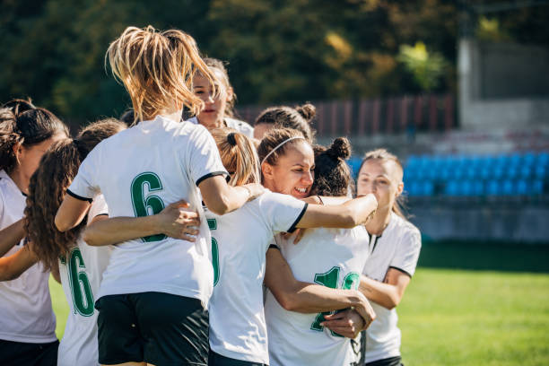 istock Women soccer team celebrating victory 1188634869