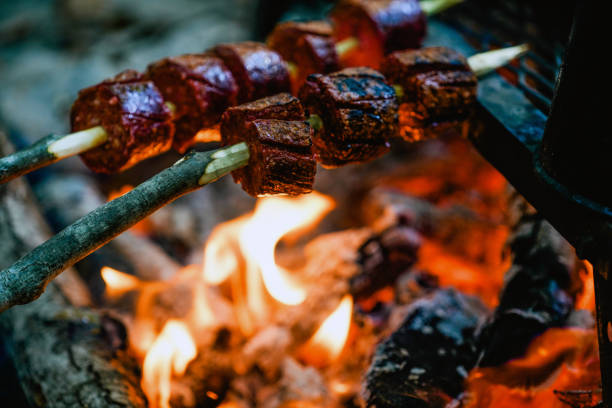 istock Sausage on a stick roasted over a camping fire 1188635133
