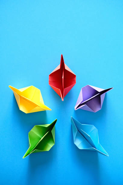 istock Authentic Origami Boats In Circle On Blue Background 1188637705