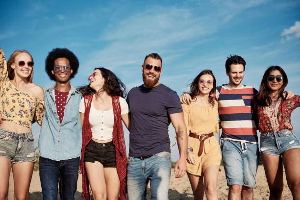 istock Young smiling people in a row on the fresh air 1188637810
