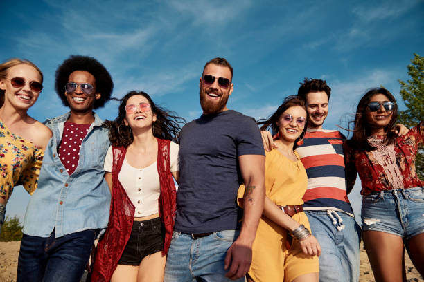 istock Young smiling people in a row on the fresh air 1188639579