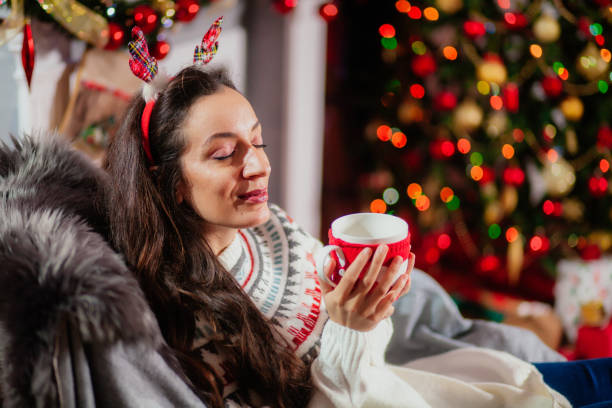 istock Cheerful woman with Christmas lights 1188641391