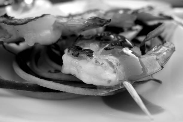 istock Grilled tasty shrimps with blur effect in black and white. 1188646172