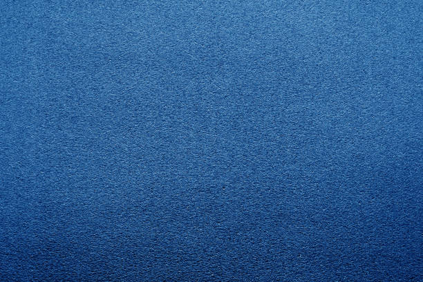 istock Plastic glittering texture with blur effect in navy blue color. 1188646632