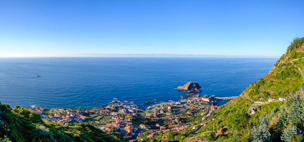Panoramic view over Porto Moniz village on the Northern coastline of Madeira island, Portugal during a summer afternoon.