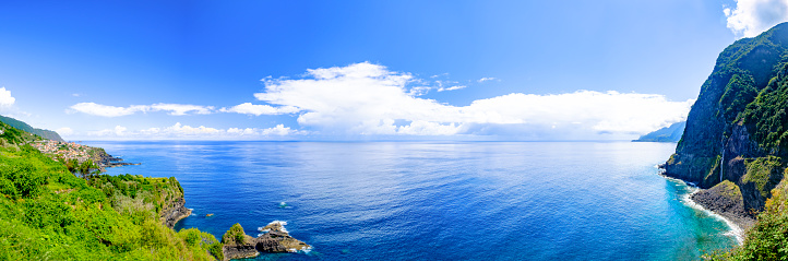 Waves hitting the coast of Madeira island at the North coast near São Vicente during a beautiful summer day.