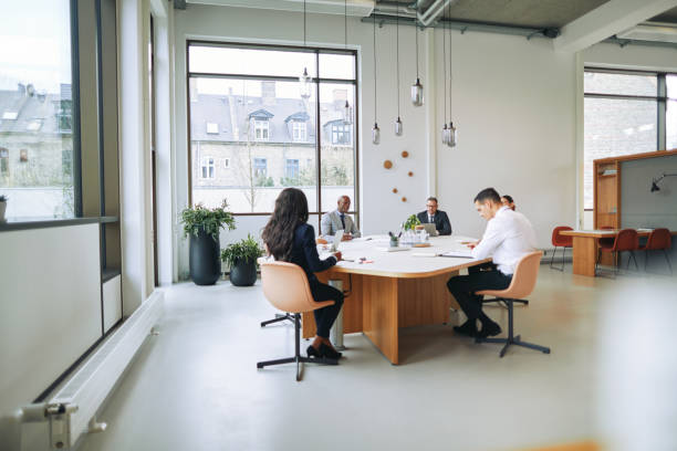 istock Diverse businesspeople discussing work together during a boardroom meeting 1188649221