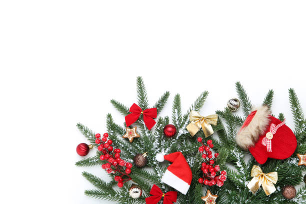 istock Christmas tree branches with toys and red berries on white background 1188650297