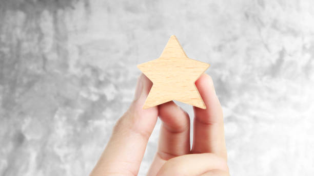 istock Hand of putting increase wood five star shape 1188651564