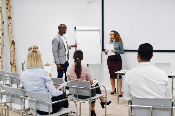 istock Diverse coworkers discussing business concepts during a presentation 1188652389