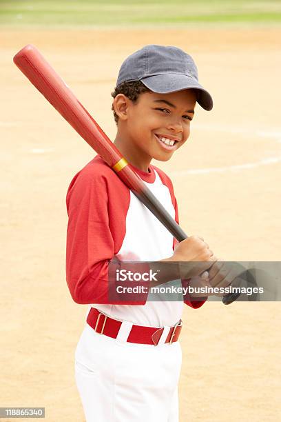 Boy With Red Baseball Bat Over Shoulder On Court Stock Photo - Download Image Now - Baseball - Sport, Child, Boys