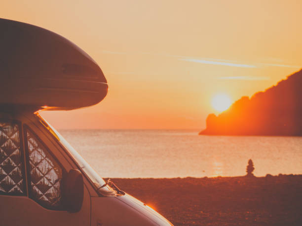 istock Camper car on nature at sunrise. Travel 1188654165