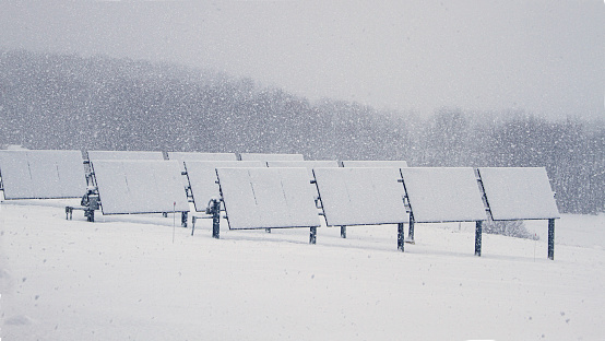 Winter storm covers solar panels in our yard. Not a great day to generate electricity