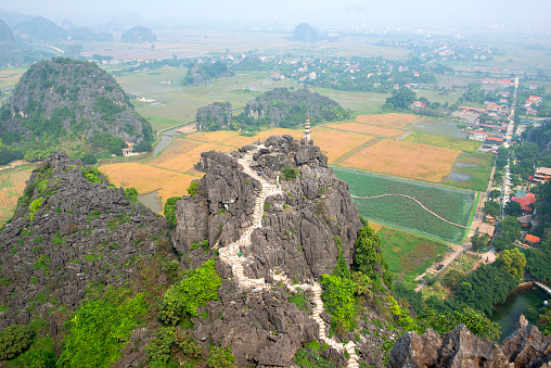 Ninh Binh, Vietnam - Mua Cave mountain viewpoint, Stunning view of Tam Coc area with mountain range, rice fields. It is such as great wall in Ninh Binh, Vietnam