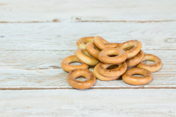 istock Fresh bagels (bagels) on a light wooden background. Bakery products. 1188661535