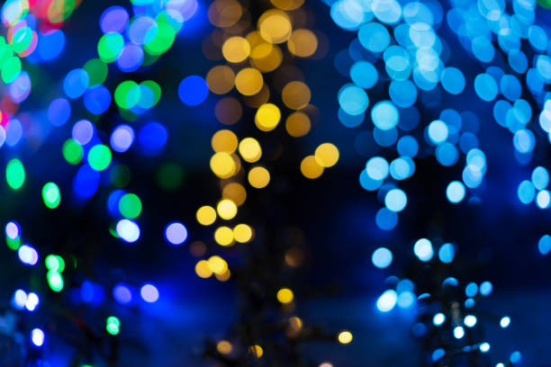 istock Defocused christmas garlands with colorful glow. Christmas background with multicolored bokeh. 1188662425