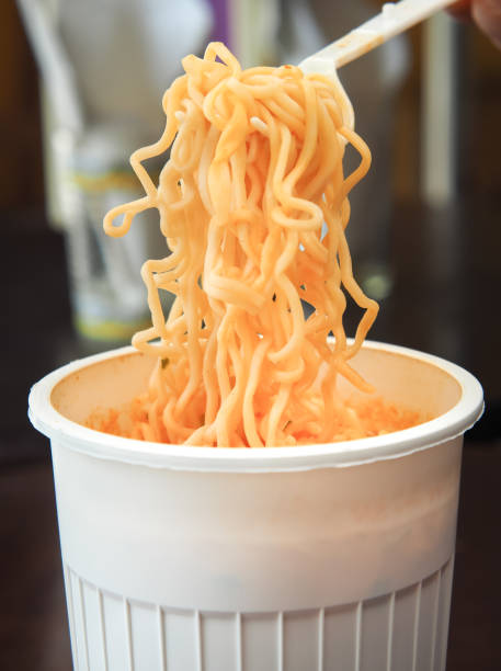 istock Cooked instant noodles soup in the white plastic cup. 1188663669