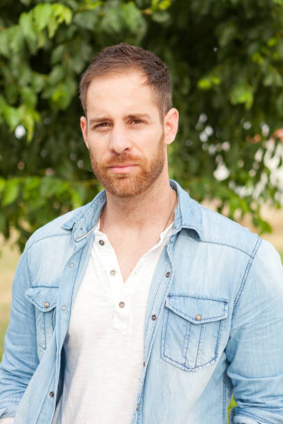 istock Casual guy with a denim shirt relaxed 1188663831