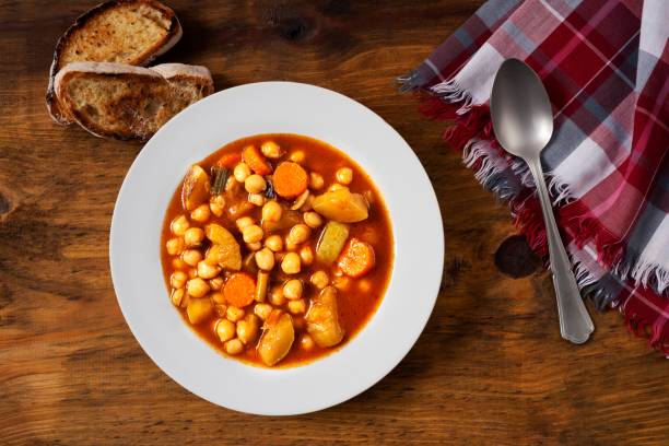 istock Chickpea vegetarian soup served in white plate. 1188663915