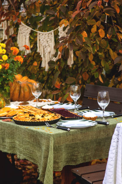 istock Dining table for a family holiday in the backyard in the fall. 1188663920
