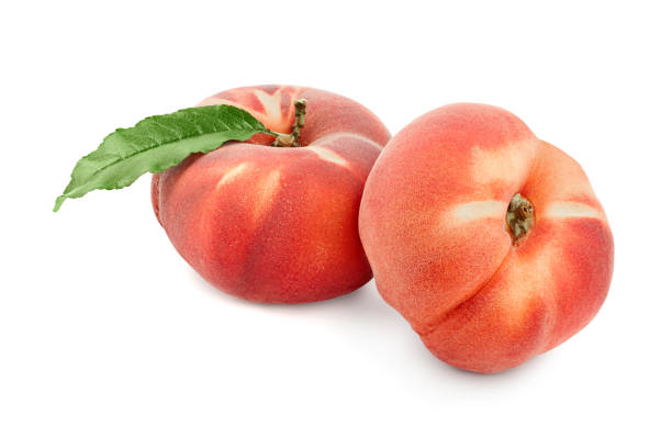 istock Ripe chinese flat peach fruit with leaf isolated on white background 1188664043