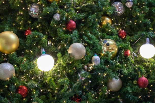 istock Christmas tree decorated with golden ball on pine branches background 1188667785