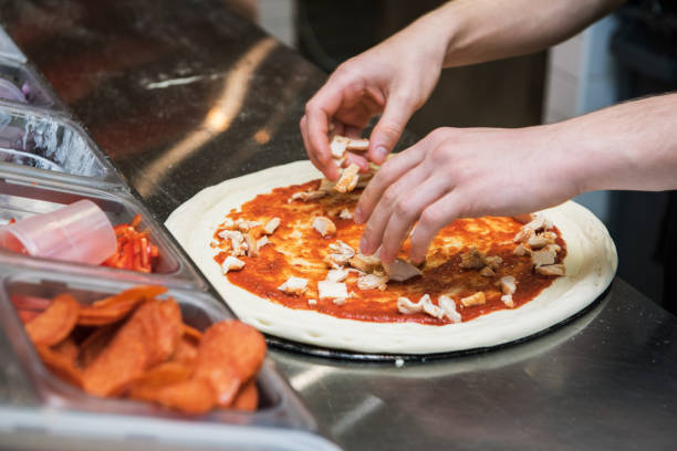 istock making pizza at kitchen of pizzeria 1188667926