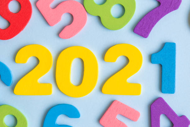 Numbers forming 2021 new year abstract on blue.