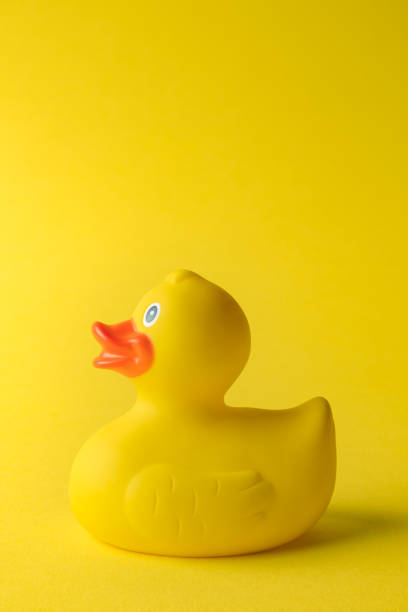 istock Rubber duck on yellow background minimal creative concept. Space for copy. 1188668616
