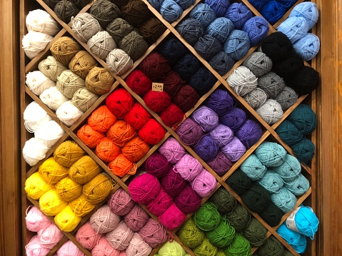 Shop display with lots of different colored wool