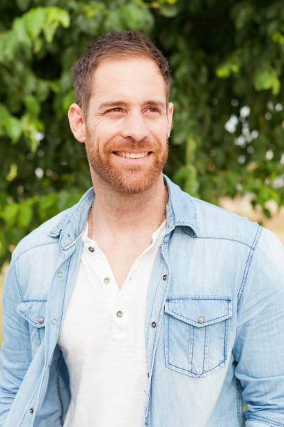 istock Casual guy with a denim shirt relaxed 1188671407