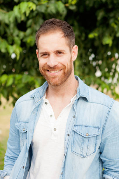 istock Casual guy with a denim shirt relaxed 1188671415