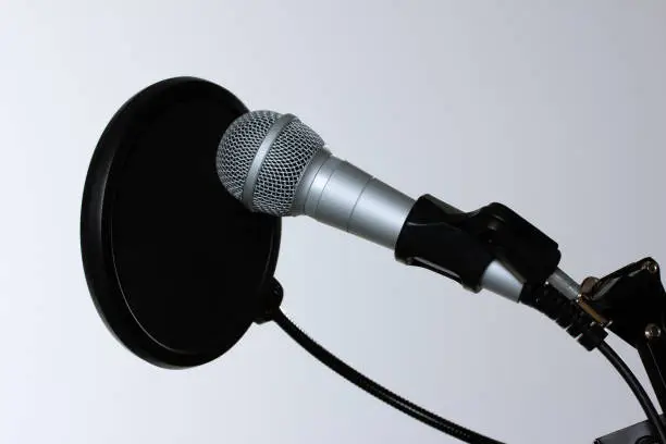 Photo of Chrome audio microphone with membrane isolated on a white background