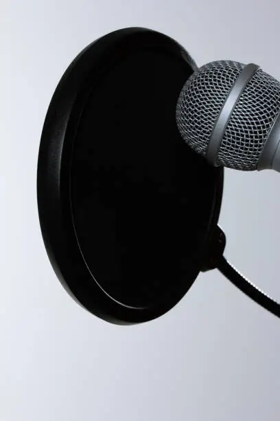 Photo of Chrome audio microphone with membrane isolated on a white background