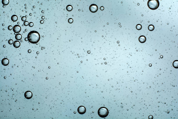 istock macro oil bubbles on the water. abstract light blue background 1188675878