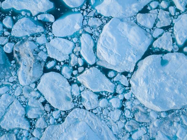 istock Icebergs drone aerial image top view - Climate Change and Global Warming. Icebergs from melting glacier in icefjord in Ilulissat, Greenland. Arctic nature ice landscape in Unesco World Heritage Site. 1188678222
