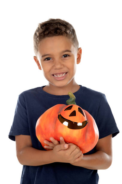 istock Happy latin boy holding a big pumpkin 1188679410