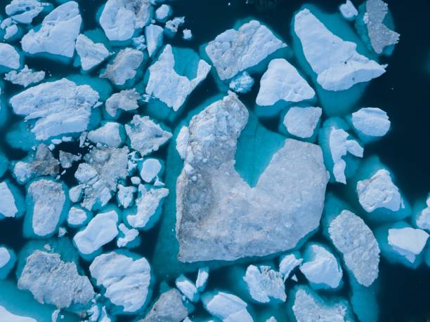 istock Icebergs drone aerial image top view - Climate Change and Global Warming. Icebergs from melting glacier in icefjord in Ilulissat, Greenland. Arctic nature ice landscape in Unesco World Heritage Site. 1188679761