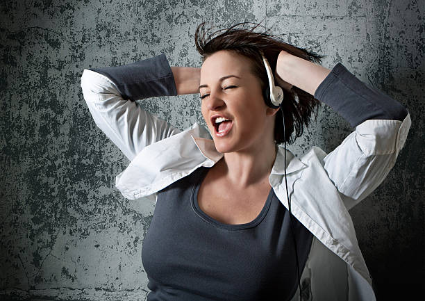 istock young woman having fun with disco music 118868170