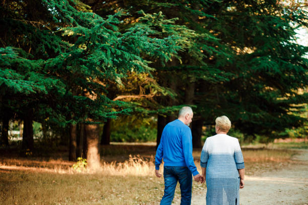 istock Pensioners walk in the park. Happy old age. 1188682322
