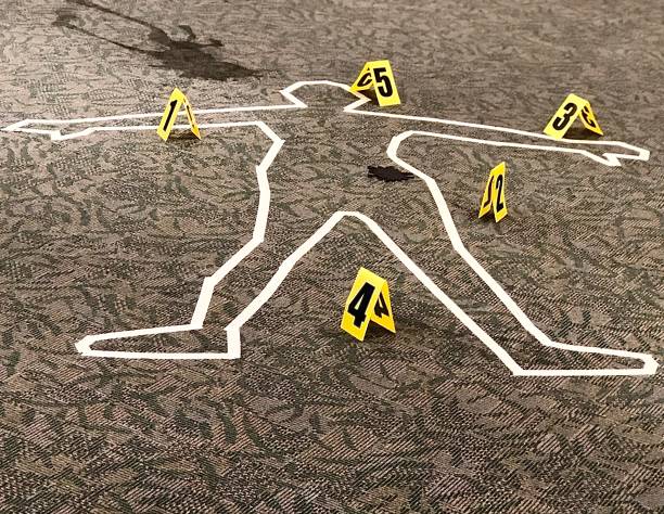 Crime scene body outline Close view of crime scene dead body outline with numbers indicated location of evidence - festive Halloween decoration chalk outline stock pictures, royalty-free photos & images