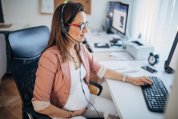 istock Pregnant woman working on computer 1188684170
