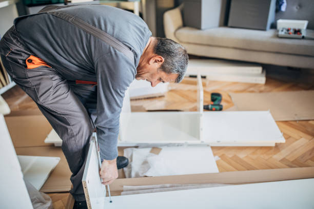 istock Senior man putting together wooden table 1188685429