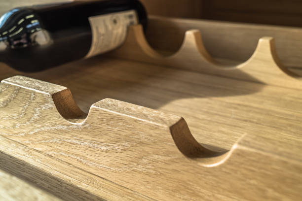 One wine bottle in a wooden shelf.