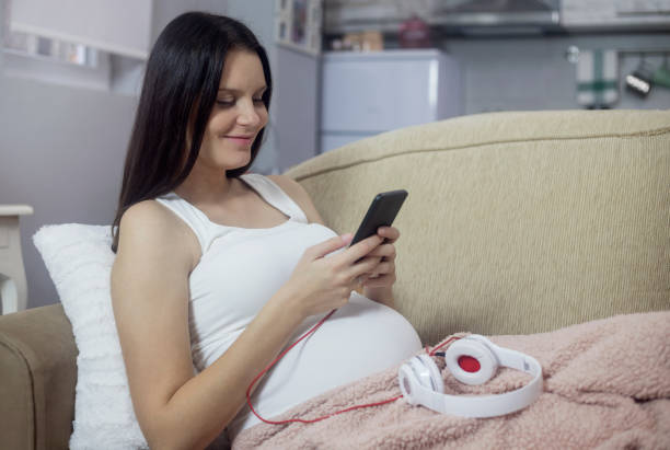 istock Pregnant woman at home 1188689848
